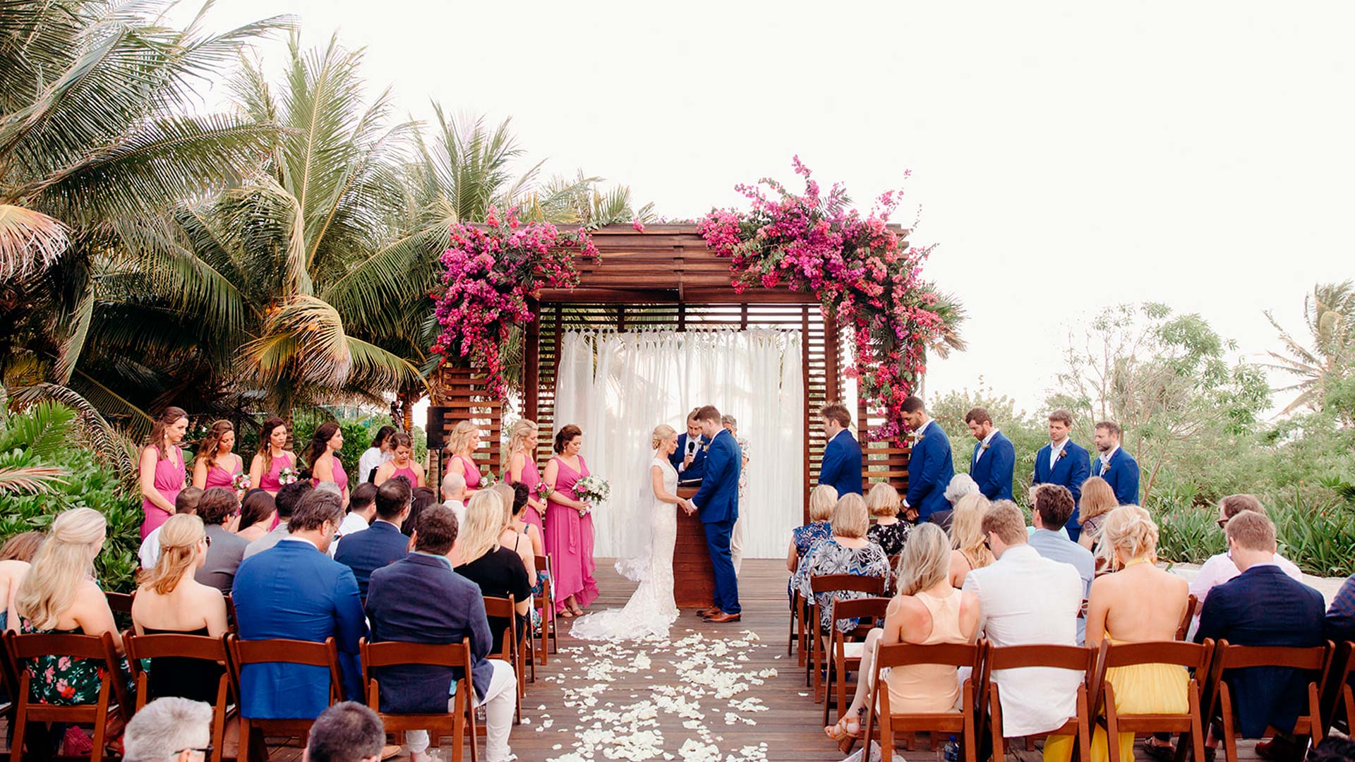 a wedding ceremony with people sitting around